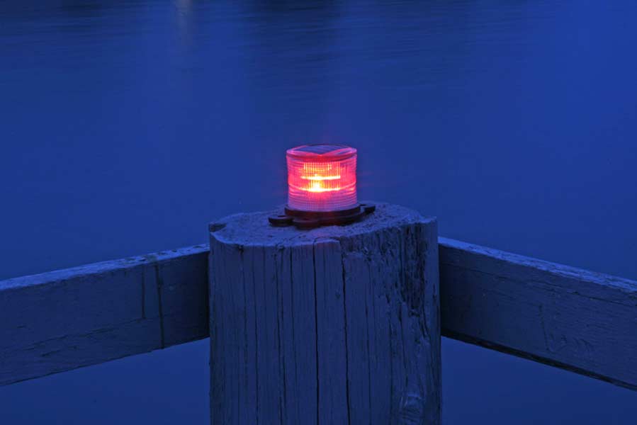 Picture of red marine solar light at night.