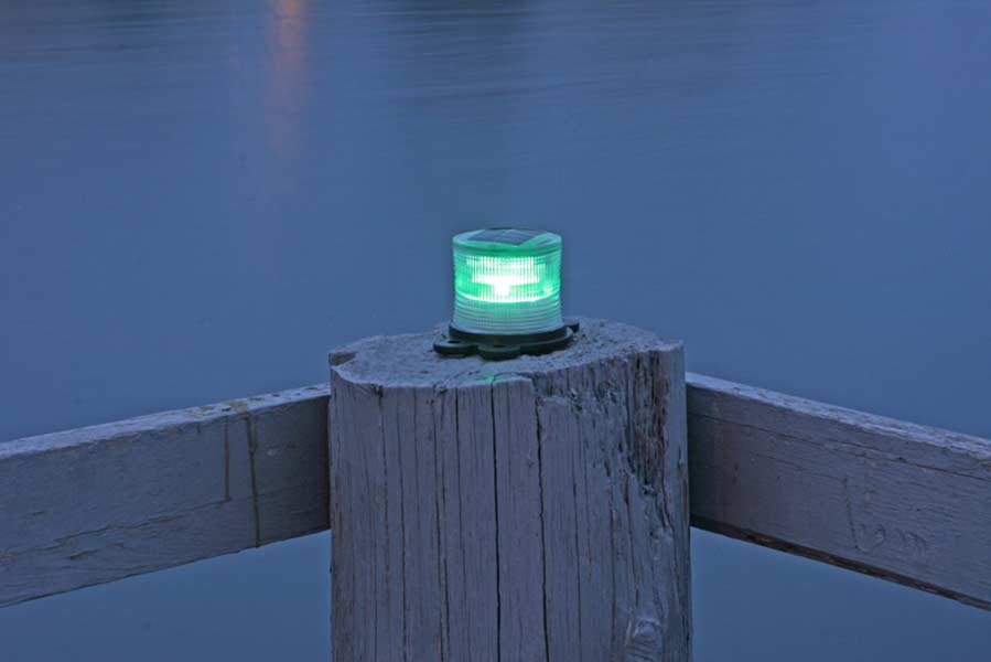 Picture of green marine solar light at night.